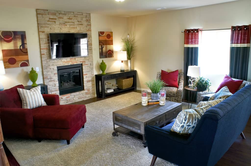 a photo of a family room with black and red color scheme