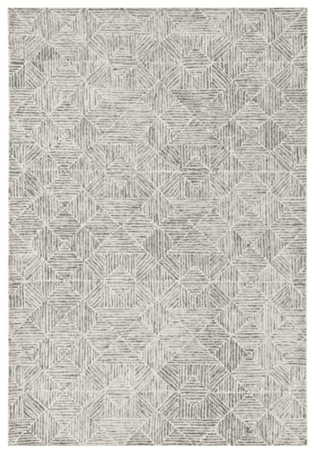 a photo of a grey and white geometric area rug
